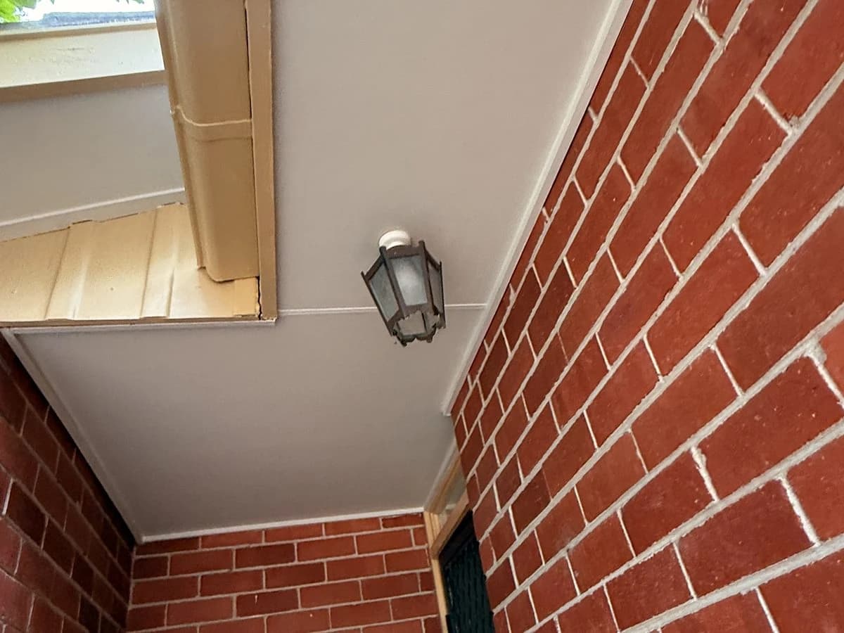 Entry porch with brick and soffit